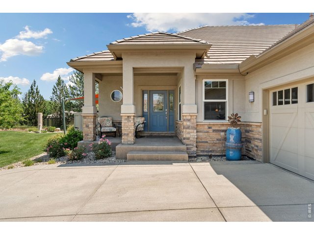 Property Photo 21 NW facing front porch with some views of the foothills- close to golf fairways!
