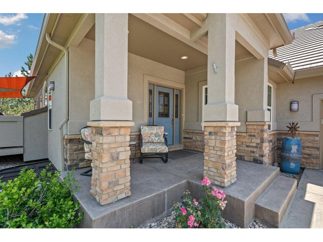Property Photo 41 NW facing front porch with some views of the foothills- close to golf fairways!
