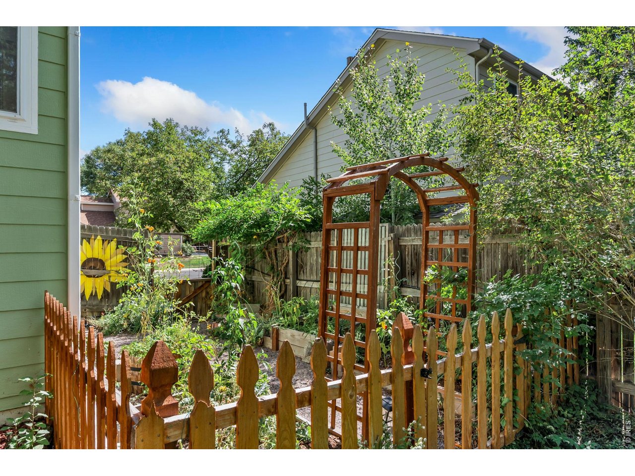 Property Photo 29 Great low-water landscaping and garden beds with sprinklers front and back