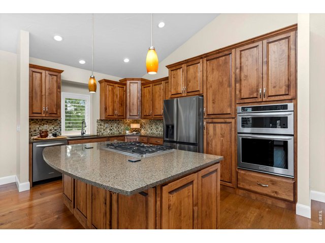 Property Photo 4 Perfectly sized kitchen with with quartz countertops, large island, pantry and all appliances