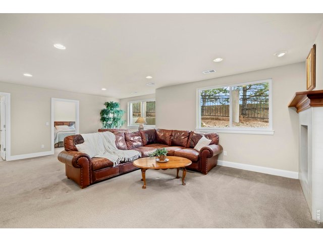 Property Photo 32 Family Room with view of Bedroom 2 and doorway to Full Bathroom.