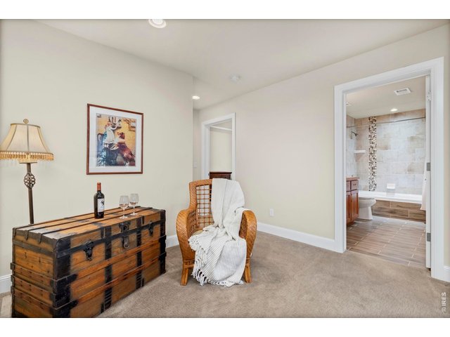 Property Photo 33 Basement lounge area with view of Bathroom Door and short hall to Bedroom 3