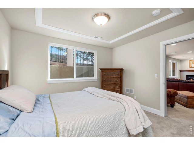 Property Photo 35 Bedroom 2 in the basement features an en suite full bathroom and walk-in closet