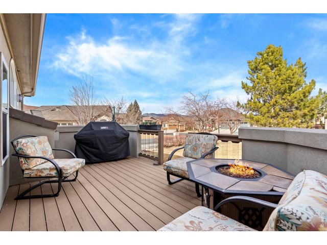 Property Photo 40 Deck includes a gas firepit, patio furniture and gas grill