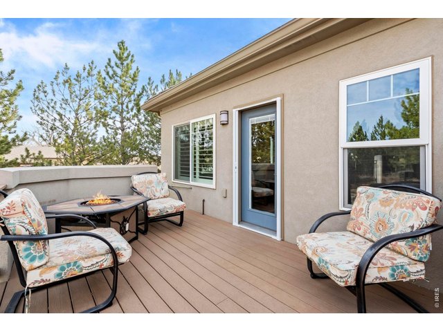Property Photo 39 Deck right off the Dining Room with views the foothills, green space and nice trees
