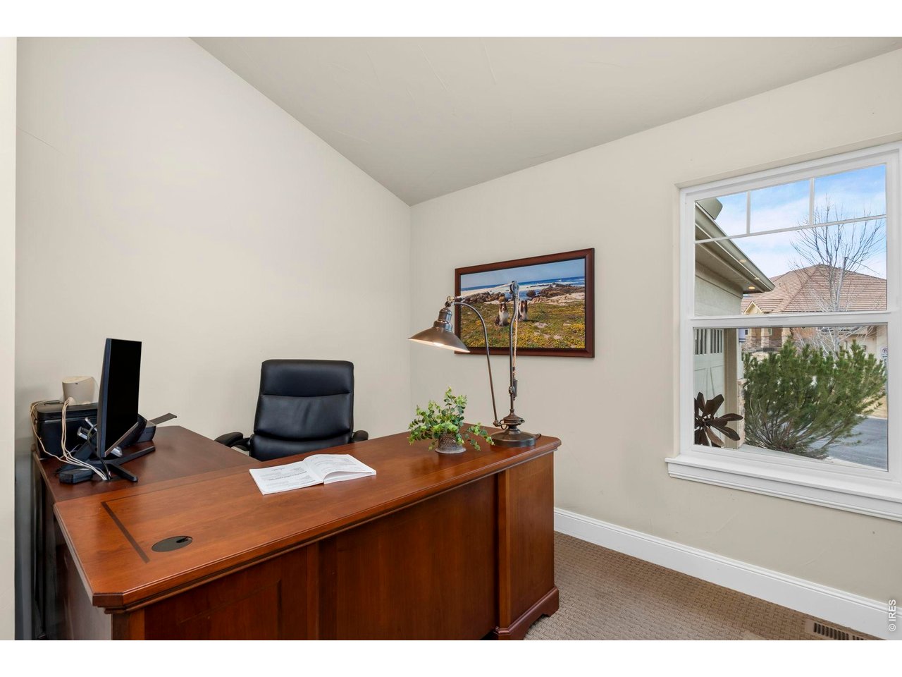 Property Photo 29 This space serves as a dedicated office on the main floor, featuring stunning views.