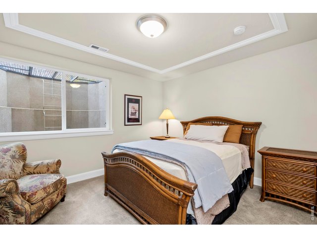 Property Photo 36 Bedroom 3 is spacious and features a large walk-in closet with custom shelving