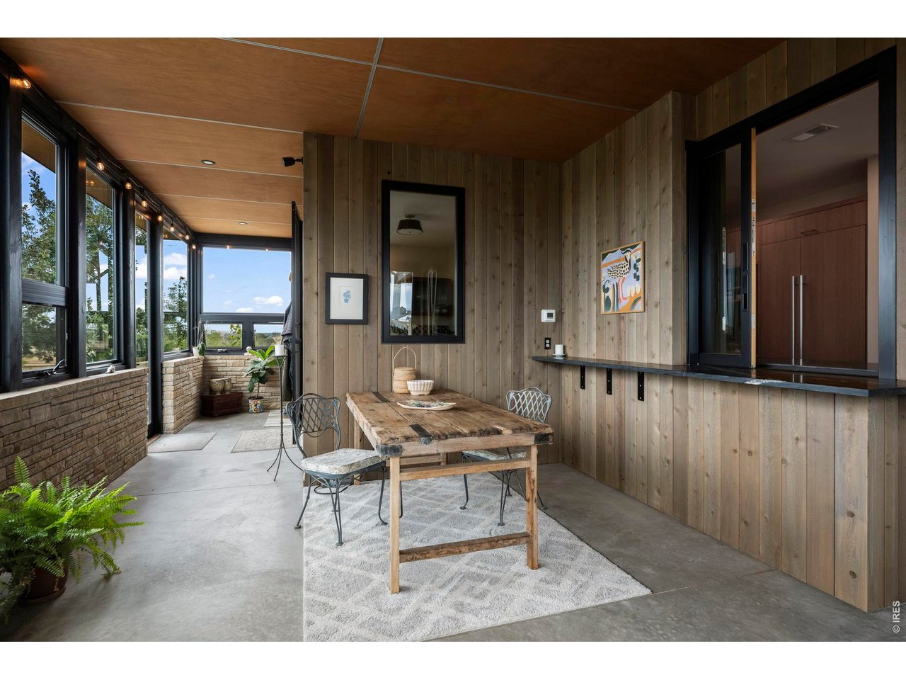 Property Photo 16 So many fun meals on the porch. Pass through window to kitchen.