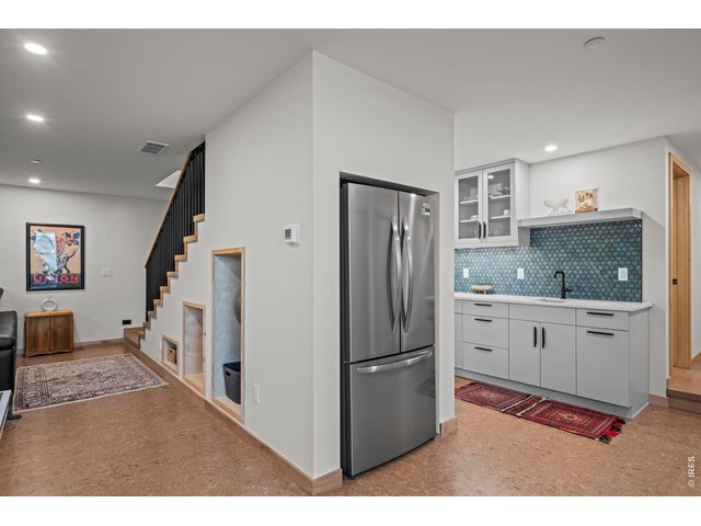 Property Photo 35 Downstairs wet bar with full size refrigerator. Perfect for entertaining or movie nights