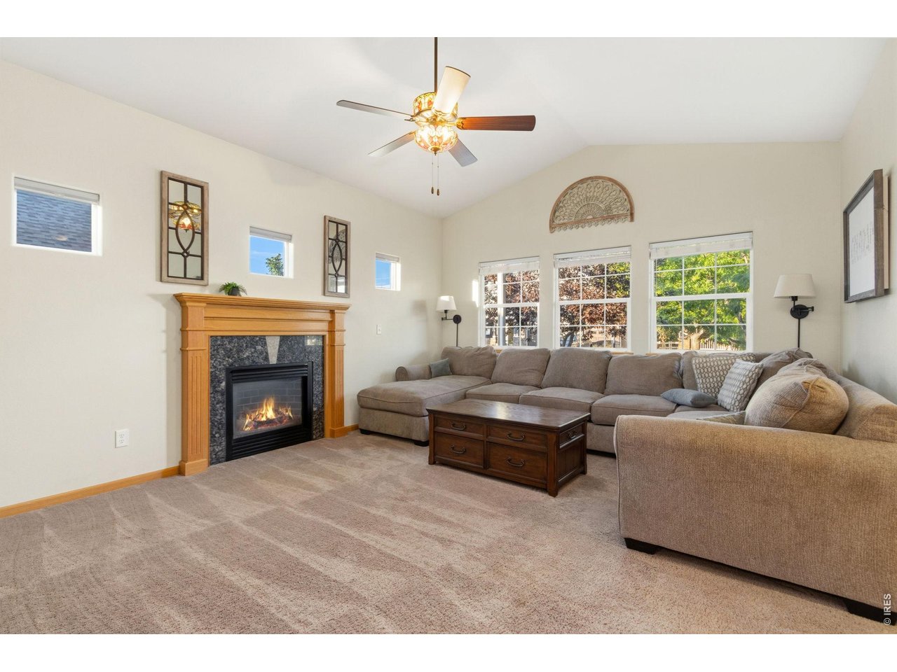 Property Photo 5 Living room features gas fireplace with great windows to the front for lots of morning light.