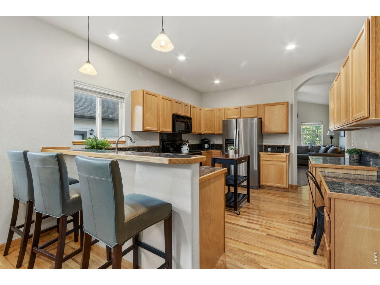 Property Photo 7 Kitchen features bar seating for entertaining.