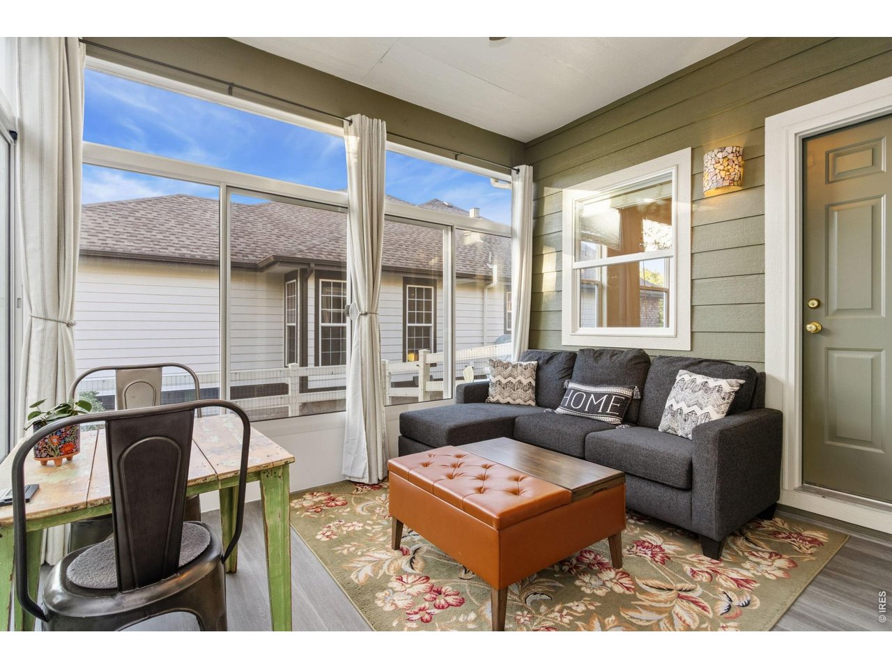 Property Photo 12 Cozy enclosed sunroom off dining room (15 x12).