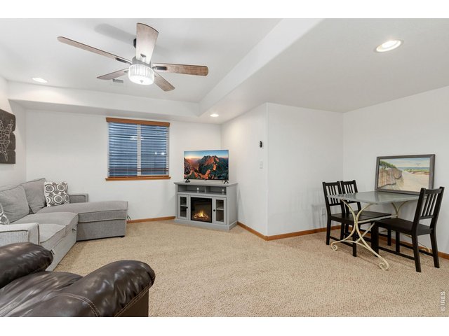 Property Photo 21 Family room in basement offers an additional living space.