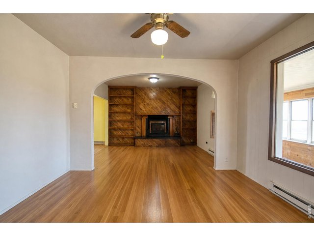 Property Photo 7 VIRTUALLY STAGED (Hardwood floors under carpet)