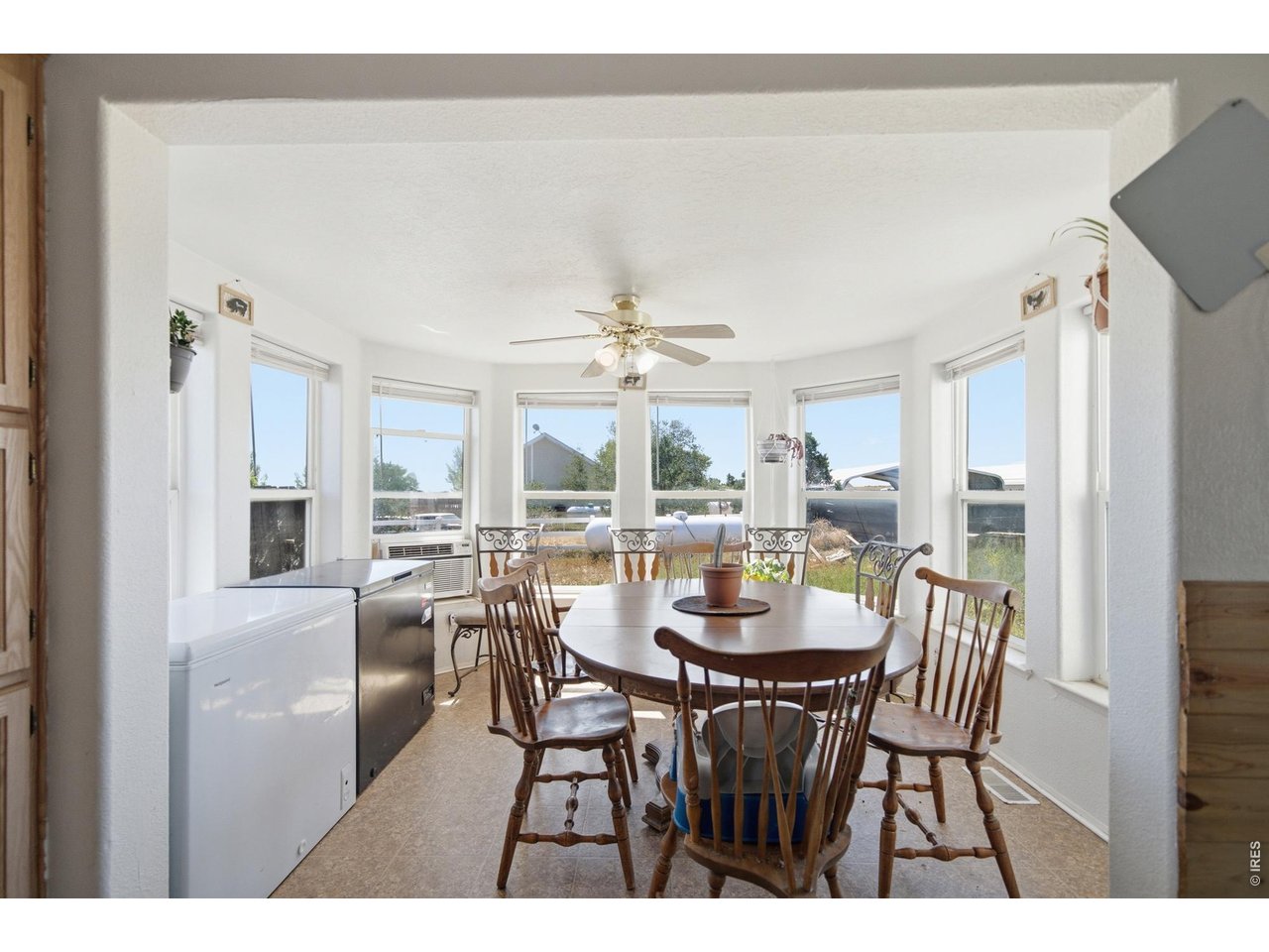 Property Photo 18 Breakfast nook with bay windows all around.