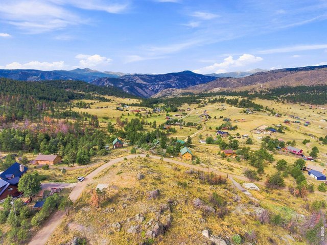 Property Photo 8 Looking west you have a perfect view of the Rockies with Long's Peak forefront.