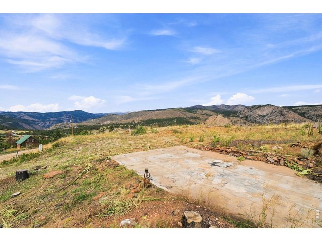 Property Photo 17 Concrete pad and well head pictured. Well is a huge value add. Well company said this could easily save 60K for next owner.
