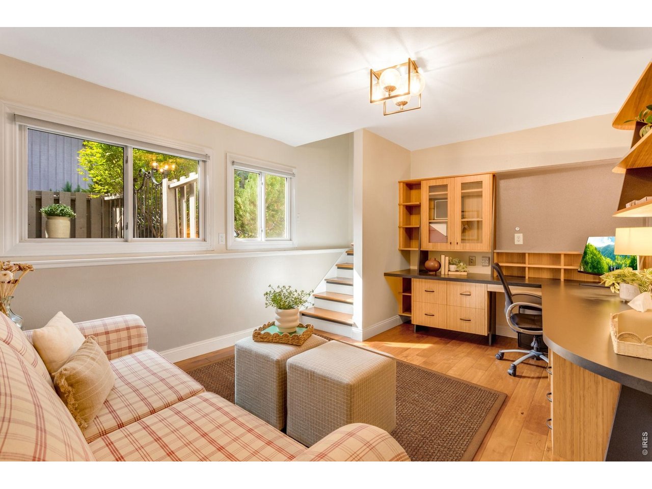 Property Photo 34 Split layout- Garden or Daylight lower-level, with practical built-in oversized desk area - the perfect in home office/flex space lounge or studio space with direct access to the 2 car garage.