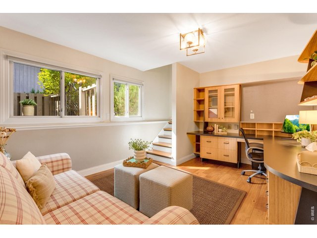 Property Photo 34 Split layout- Garden or Daylight lower-level, with practical built-in oversized desk area - the perfect in home office/flex space lounge or studio space with direct access to the 2 car garage.