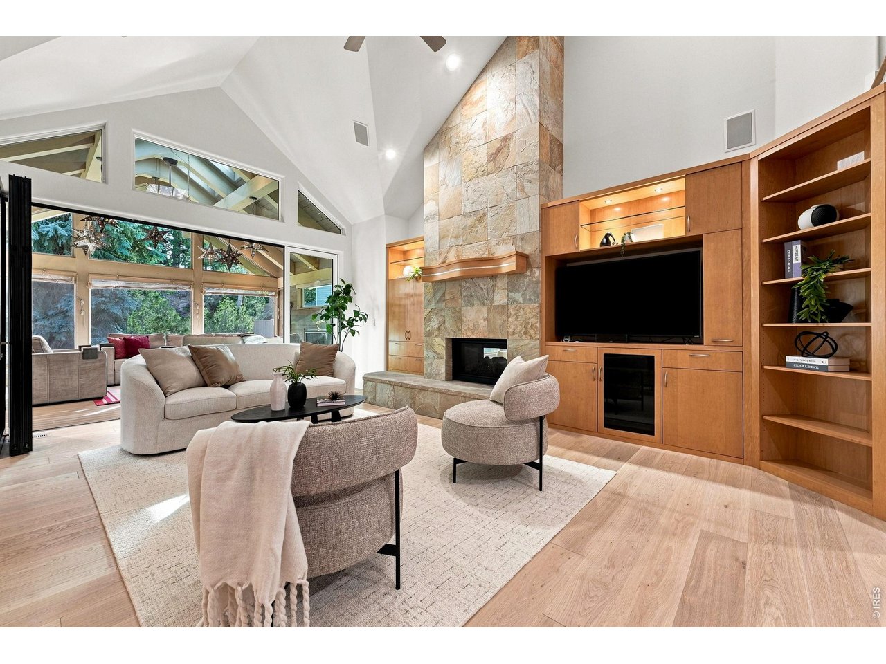Property Photo 5 Built in Cabinets Media with custom Two Sided Fireplace.