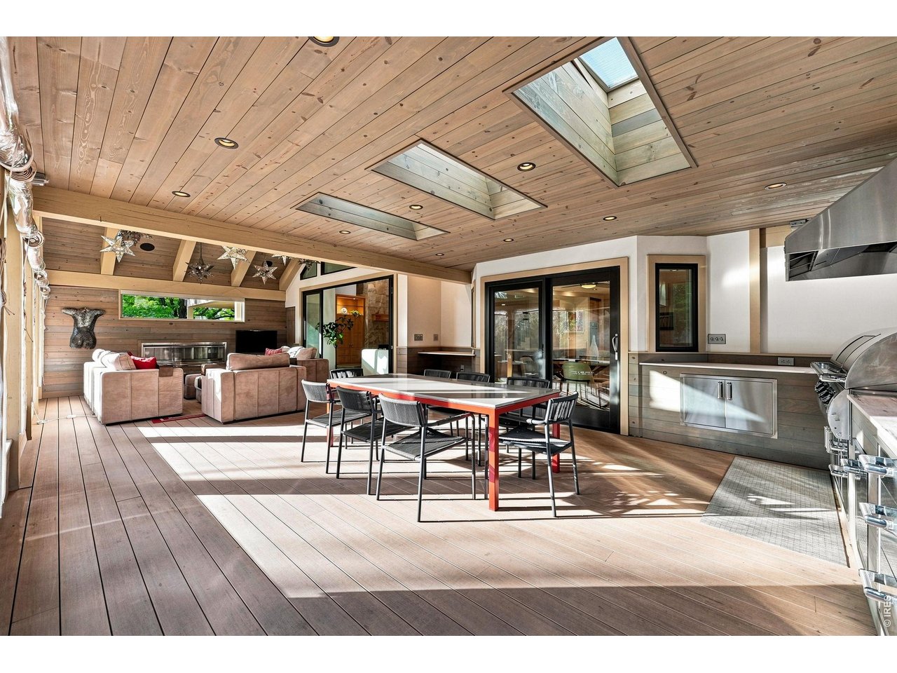 Property Photo 19 Outdoor Kitchen with Granite Buffet Area and Dining