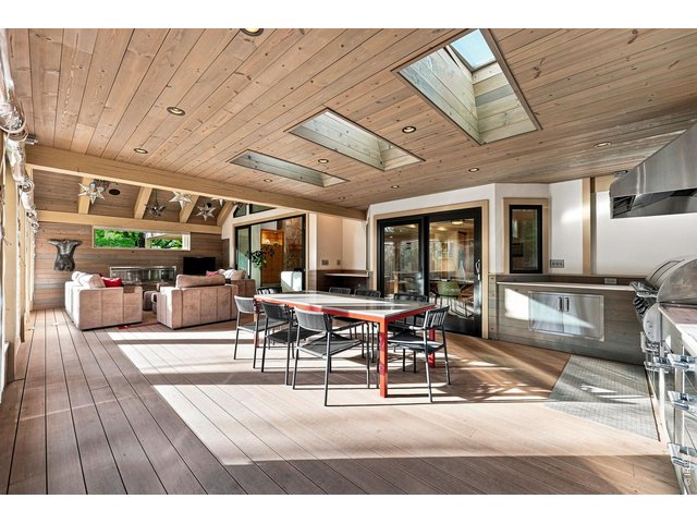 Property Photo 19 Outdoor Kitchen with Granite Buffet Area and Dining