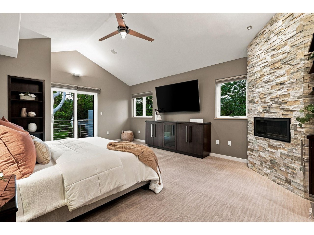 Property Photo 26 Primary bedroom with built in sound system, blackout shades, fireplace