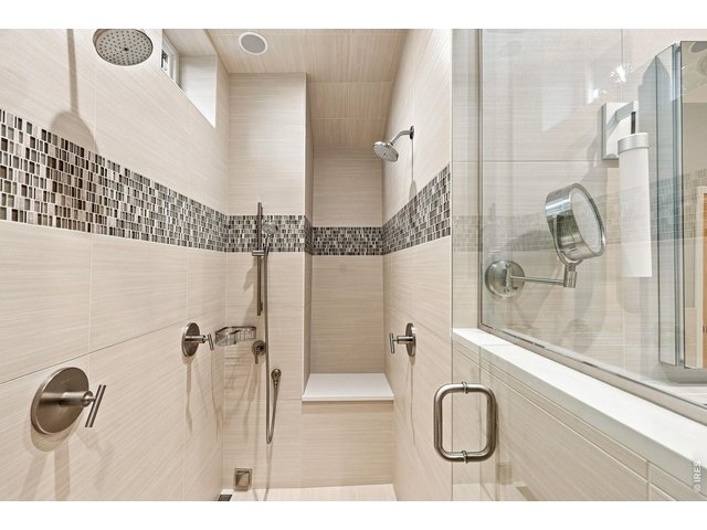 Property Photo 28 Rain head and Steam shower systems, sound system, and Heated Floors