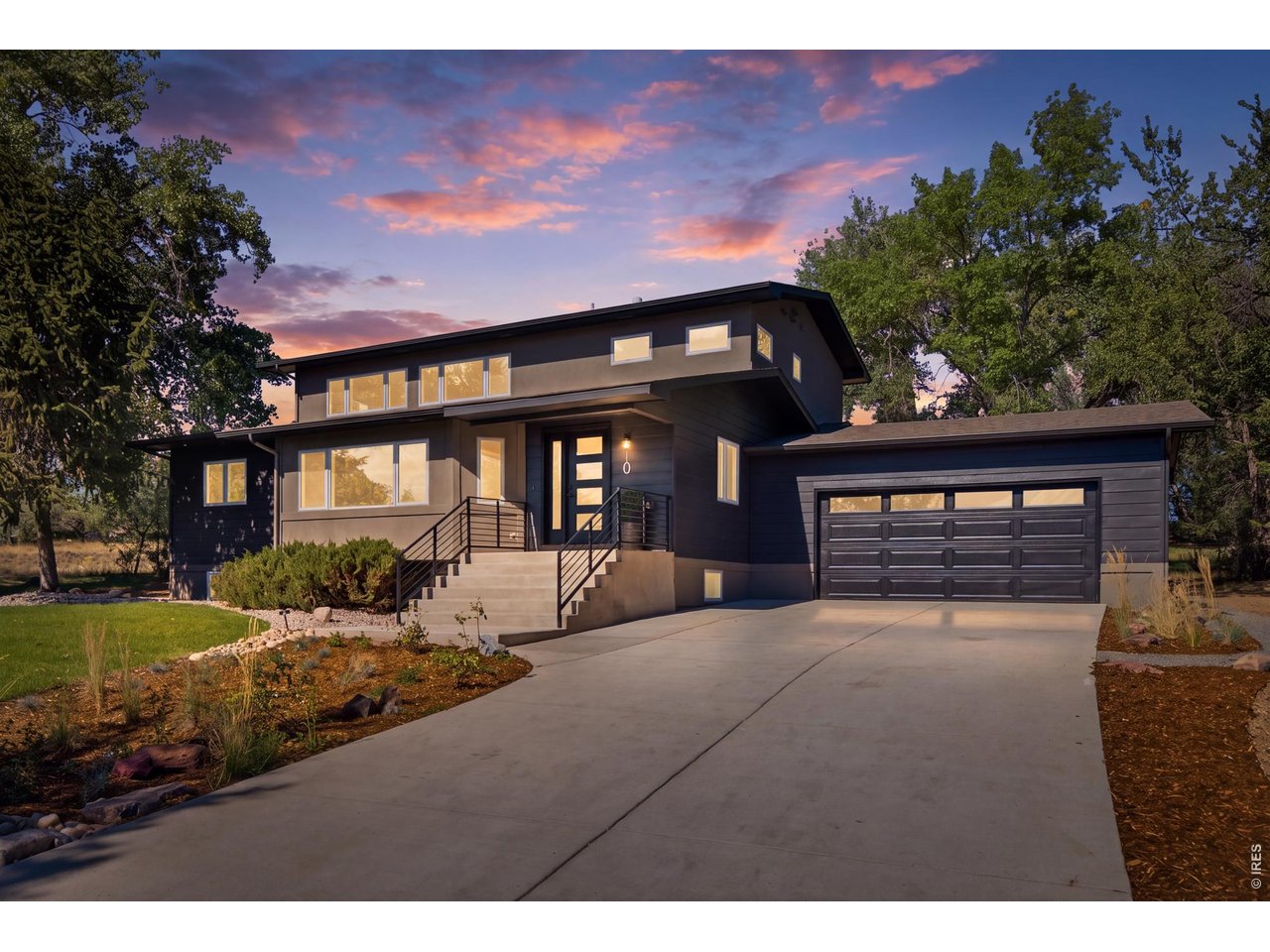 Property Photo 4 New front steps and a new garage door create those proper entryways that the home needed.