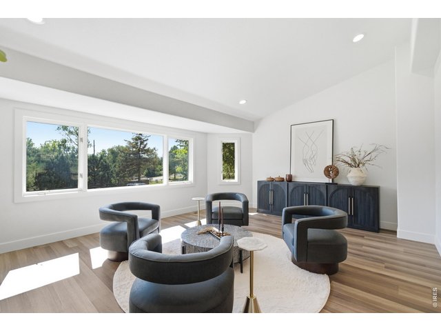 Property Photo 8 The large bay window in the front keeps this living room nice and bright.