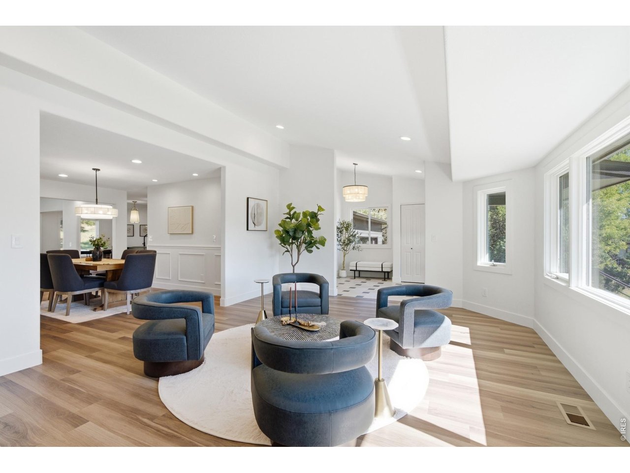 Property Photo 9 The living room leads seamlessly into the formal dining room and rest of the entertaining spaces.