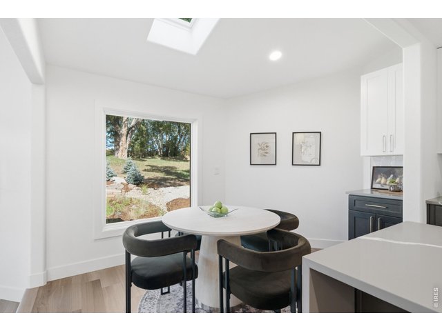 Property Photo 15 A separate breakfast nook is the perfect spot to have morning coffee and lookout over the backyard oasis.