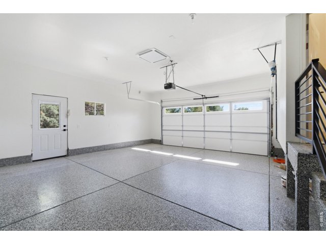 Property Photo 27 The fully updated garage has a brand new concrete slab, complete with epoxy, and new drywall enclosure.