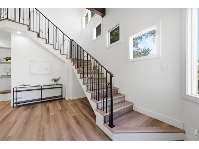 Property Photo 28 The elegant and delicate custom stair railing guides you up to the upper level.