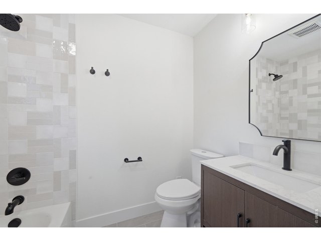 Property Photo 31 Custom tile finishes out a gorgeous tub and shower for guests.