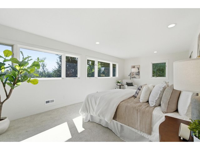 Property Photo 32 The primary bedroom is large enough to accommodate a seating area.