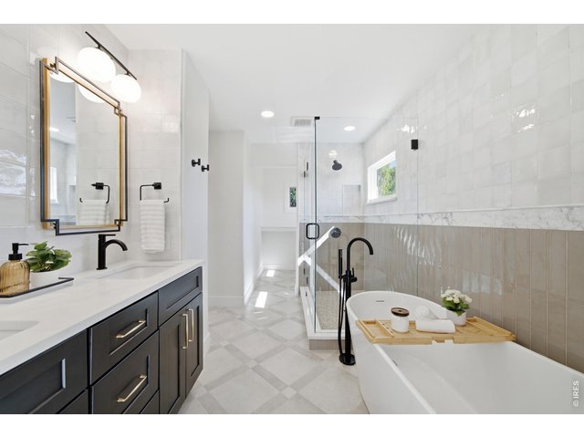 Property Photo 35 A free-standing soaking tub and frameless shower await you.