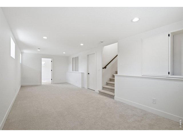 Property Photo 36 The daylight basement provides for an added rec-room, as well as storage in the crawlspace.