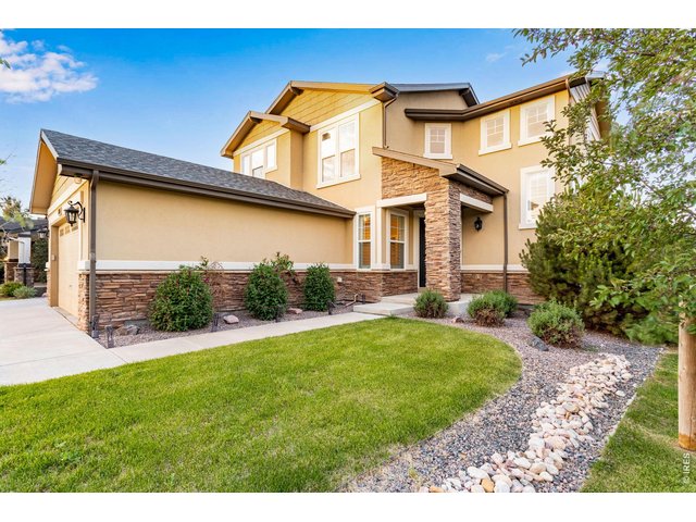 Property Photo 9 Stucco and stone exterior