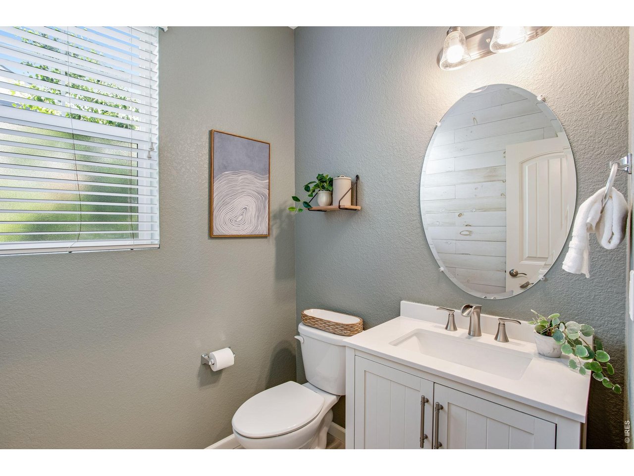 Property Photo 24 Guest half bath on main with pedestal sink and tile flooring