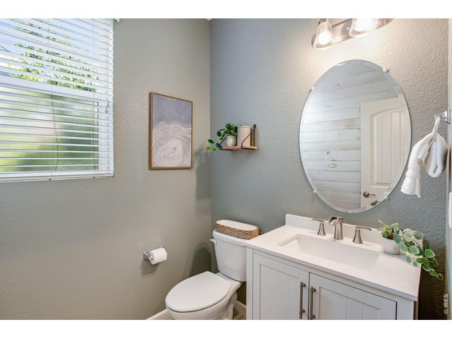 Property Photo 24 Guest half bath on main with pedestal sink and tile flooring