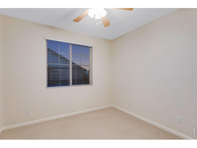 Property Photo 34 Bed 2 of 3 up with a ceiling fan