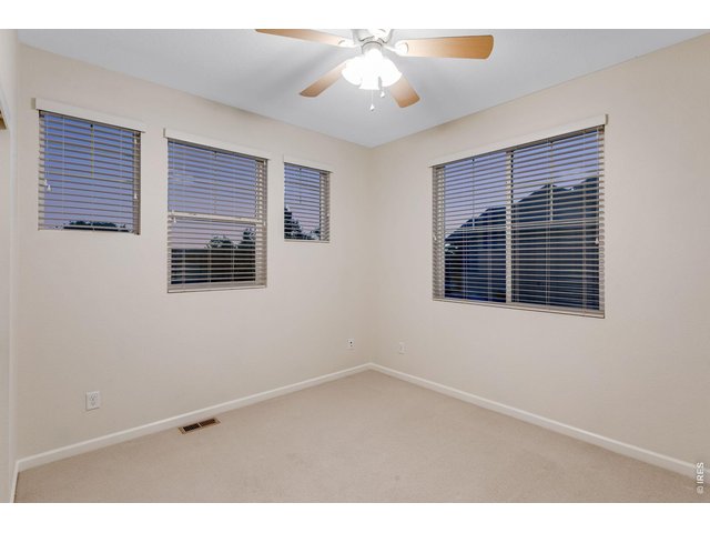Property Photo 36 Bed 3 of 43 up with a ceiling fan.
