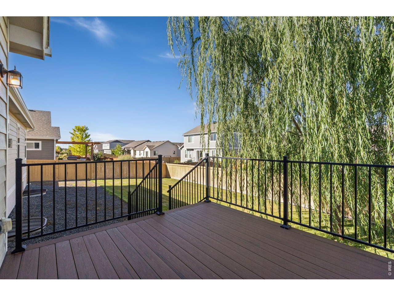 Property Photo 28 Wonderful willow tree provides shade for back yard