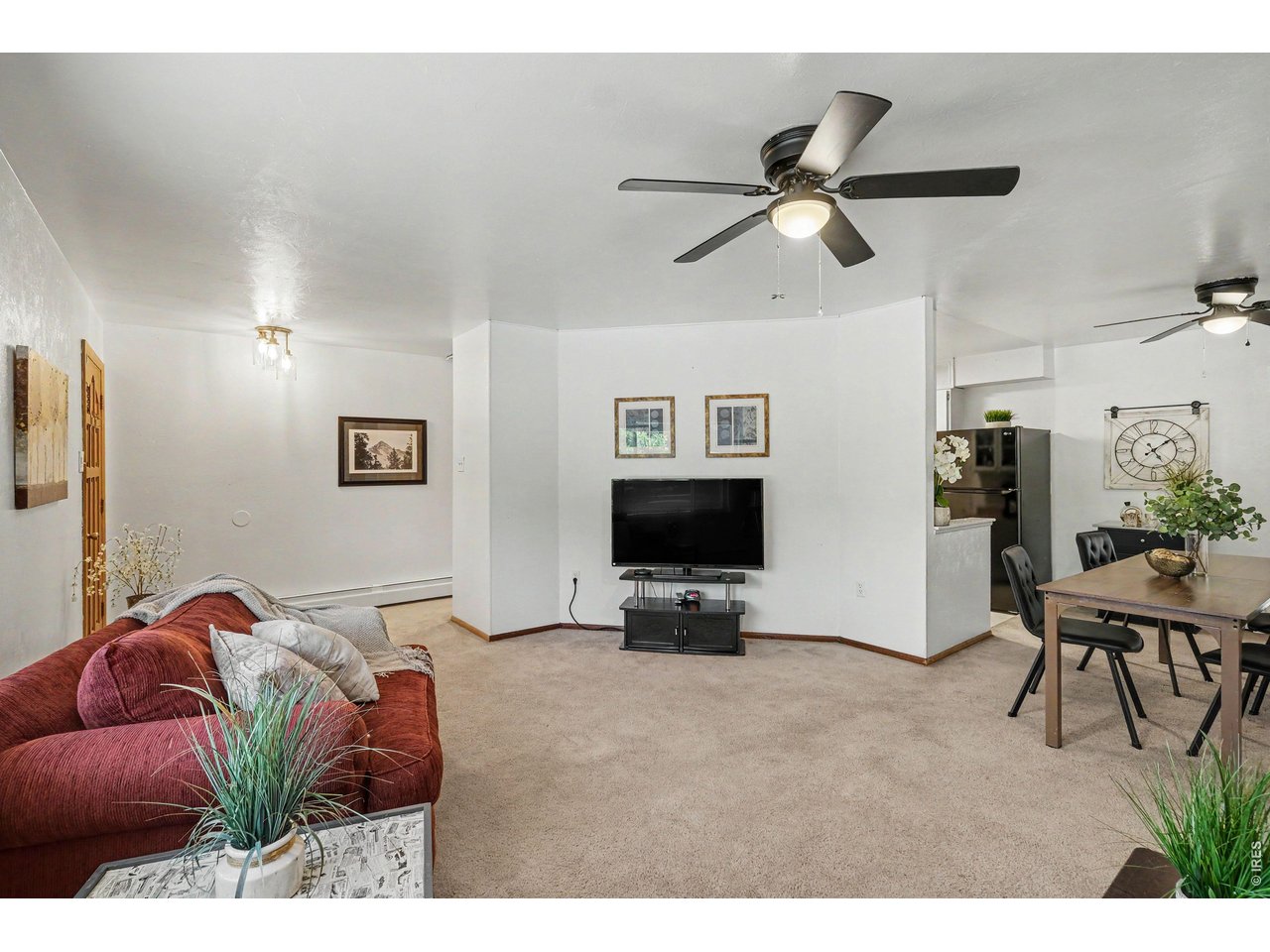 Property Photo 6 Living room open to dining room.