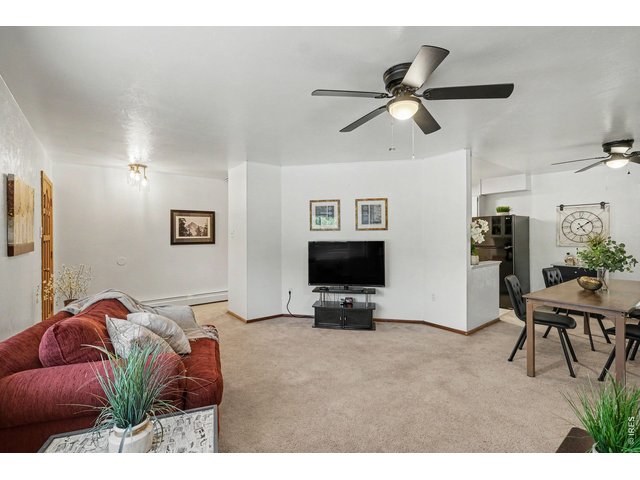 Property Photo 6 Living room open to dining room.