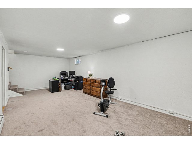 Property Photo 15 Finished basement and new carpet in 2025.