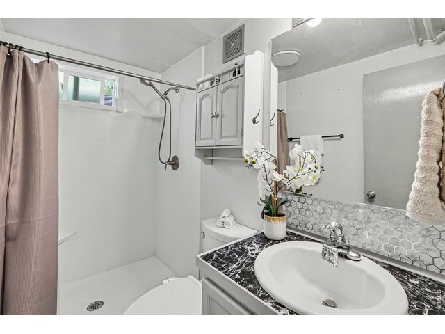 Property Photo 19 Second bathroom located in basement.
