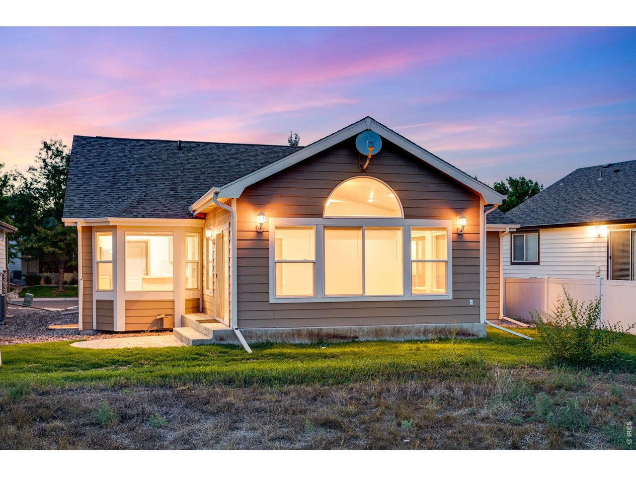 Property Photo 4 Backs to open space and features a side patio and large sun room
