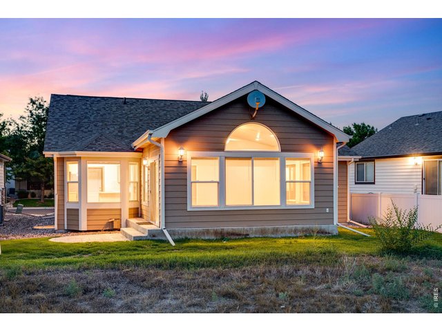 Property Photo 4 Backs to open space and features a side patio and large sun room